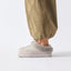 Mikayla grey faux fur lined slipper facing left in side profile with cushioned sole