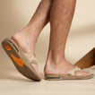 Fanning men's tan sandal facing right, showing sole and side with soft-rebound cushioning and arch support.
