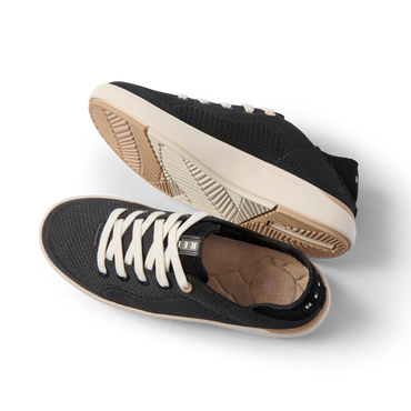 Neptune 2 black sneakers angled left, showing the lace up upper and textured outsole with cushioned comfort and arch support