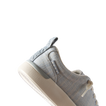 Close-up of the left side of Neptune Alana sneaker in blue textile, showing arch support and cushioned sole.