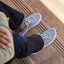 Neptune HT facing forward on feet wearing dark jeans, men's grey water-friendly sneaker with REEFlex cushioning and arch support
