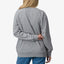 Woman wearing Oversized Raglan Fleece in heather grey, back view, highlighting comfortable beach-inspired casual apparel.