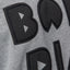 Close-up of the front chest embroidery on the Oversized Raglan Fleece in heather grey with soft, comfortable fabric.