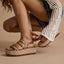 Water Vista Higher right sandal facing left with leopard print platform straps on a model's foot showing adjustable back strap.