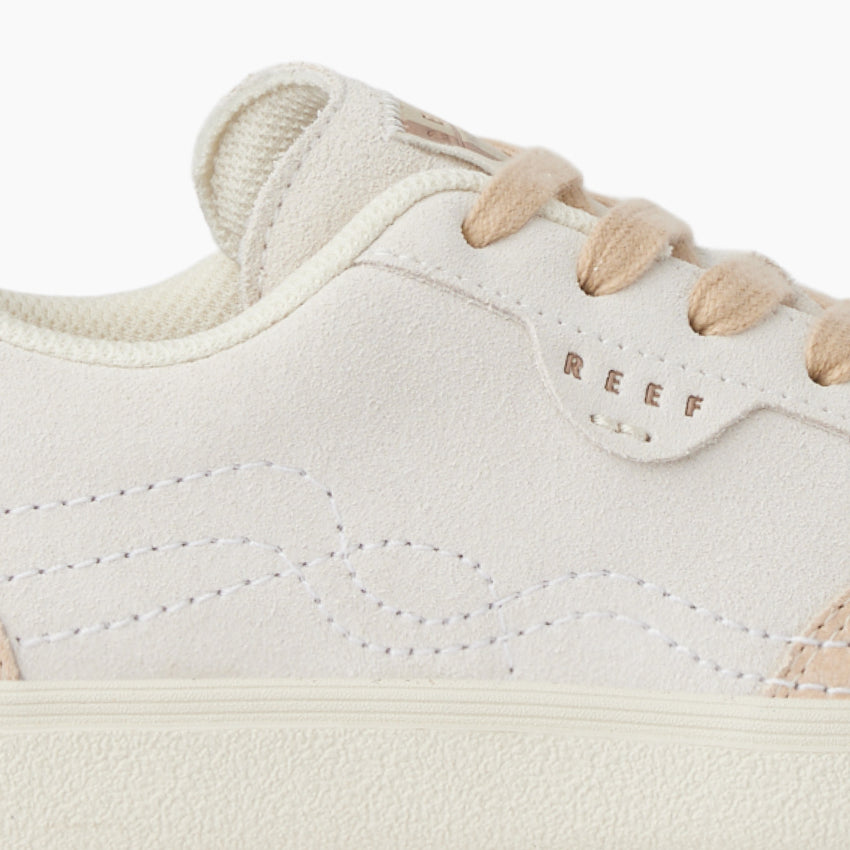 Close-up of the left side of the Boardwalk Callie sneaker showing soft-rebound cushioning and surf-inspired design.