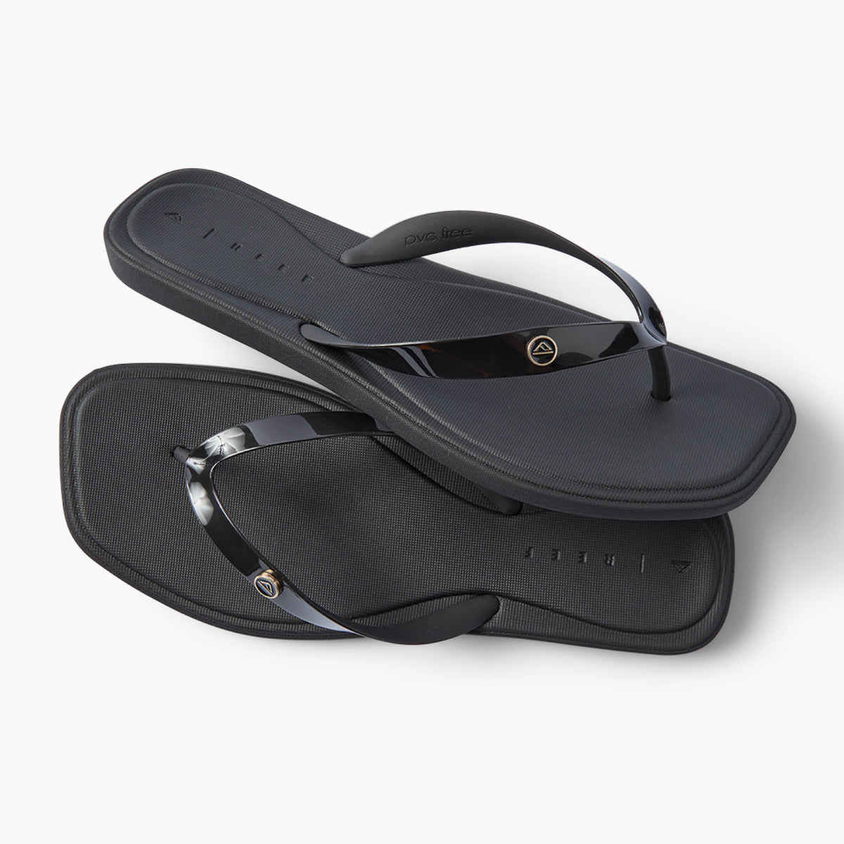 Solaye black water friendly flip flops facing right with sleek jelly straps and cushioned footbeds