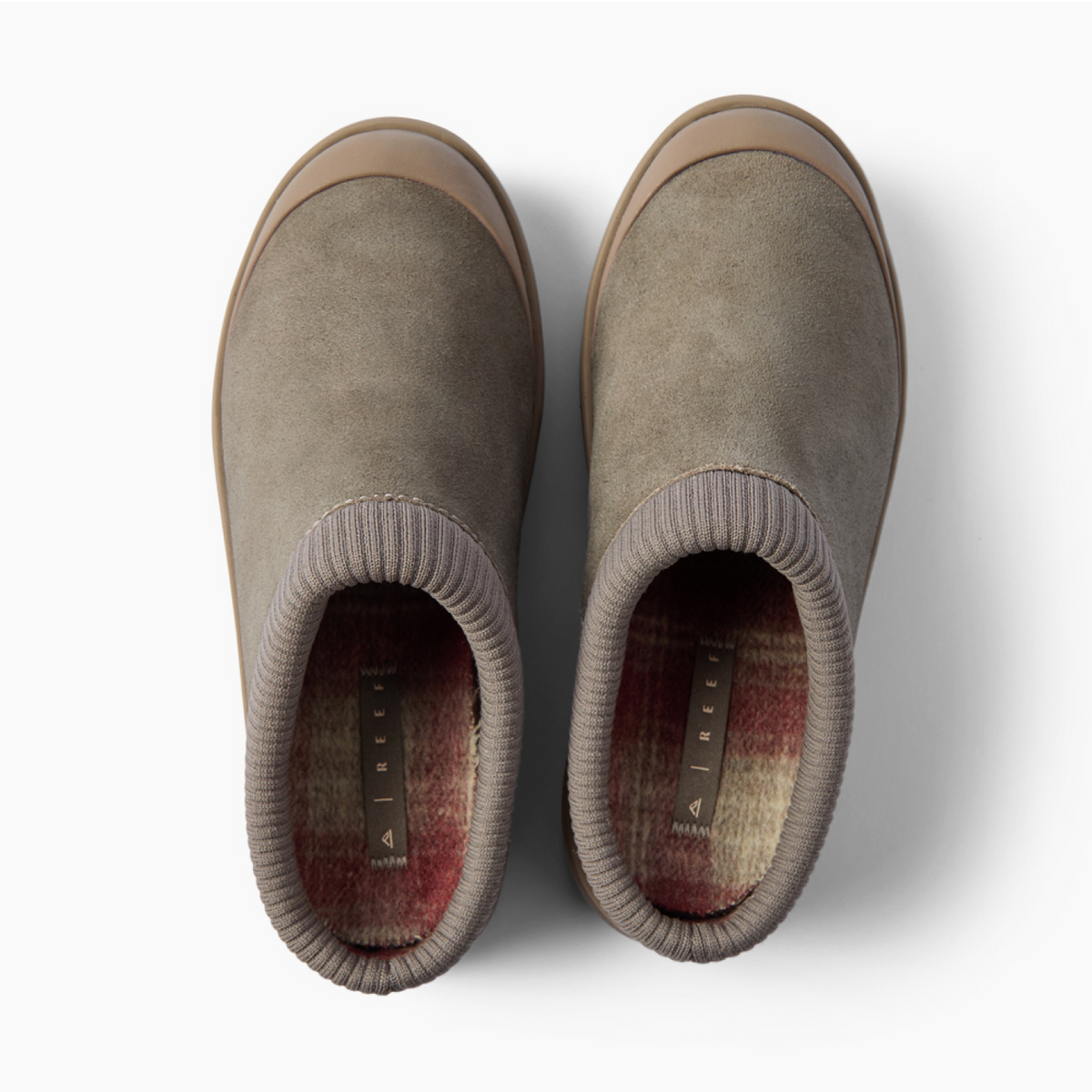 Top view of taupe slip-on clogs facing upward, with ribbed collars and soft plaid footbeds.