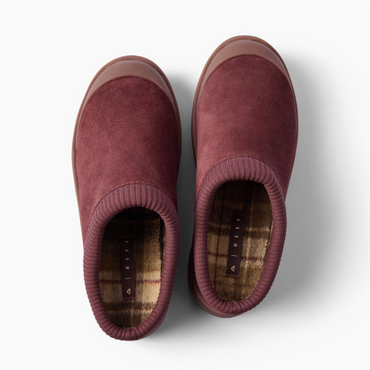 Top view of burgundy clogs facing upward, with ribbed collars and warm plaid insoles