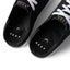 Close-up top view of the black Neptune HT shoes facing upward, showcasing REEF comfort and arch support.