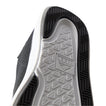 Close-up of the black Neptune HT shoe sole facing upward, showing durable, water-friendly tread with REEF comfort technology.