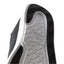 Close-up of the black Neptune HT shoe sole facing upward, showing durable, water-friendly tread with REEF comfort technology.
