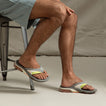 Fanning + men's grey flip flops facing right, showing top and side view with arch support and cushioned sole, beach-inspired design.
