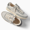 Kickback grey sneakers with one facing right and one angled toward the viewer for comfortable everyday wear