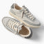 Kickback grey sneakers with one facing right and one angled toward the viewer for comfortable everyday wear