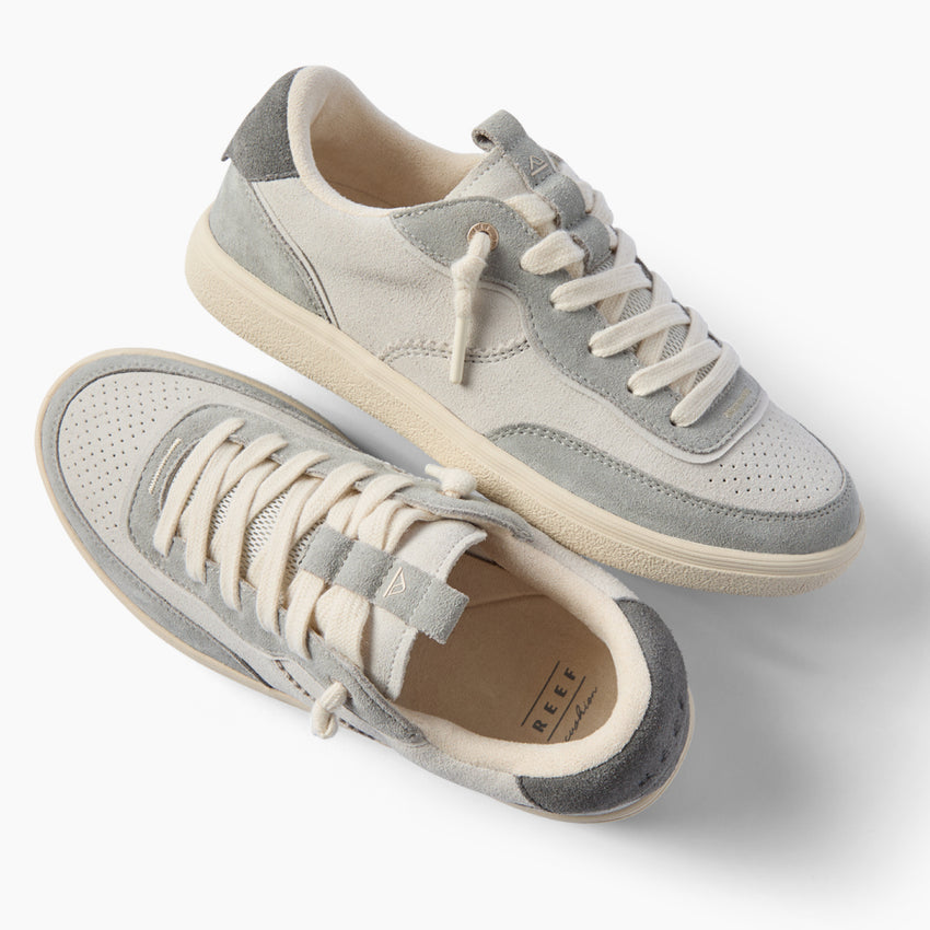 Kickback grey sneakers with one facing right and one angled toward the viewer for comfortable everyday wear
