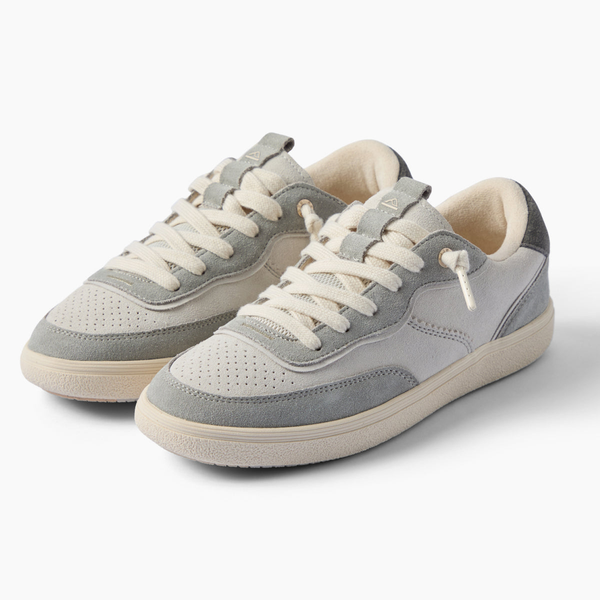 Kickback gray sneakers facing left, with layered panels, perforated toes, and cushioned everyday comfort.
