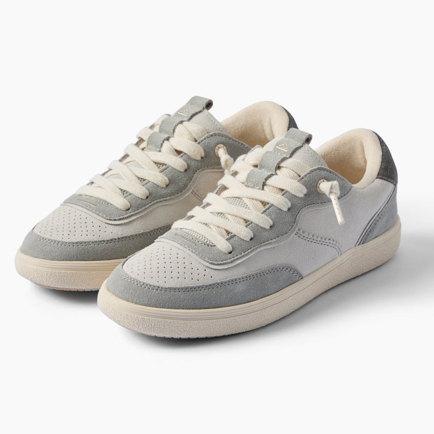 Kickback gray sneakers facing left, with layered panels, perforated toes, and cushioned everyday comfort.