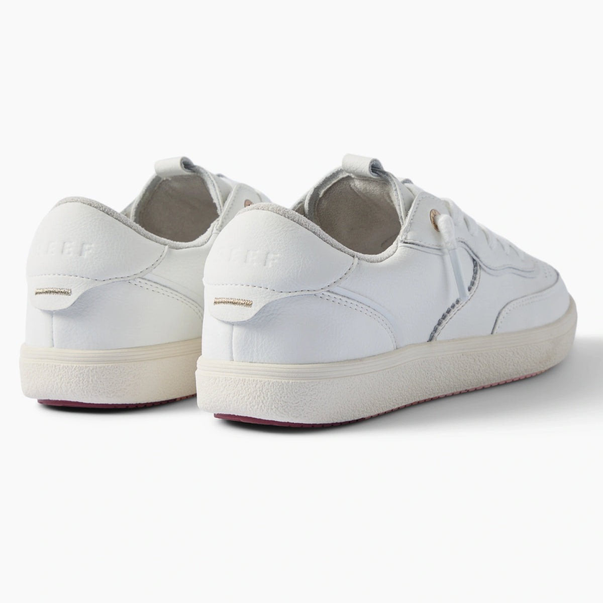 Kickback white sneakers viewed from the rear three quarter angle with toes facing right