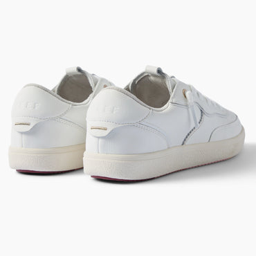 Kickback white sneakers viewed from the rear three quarter angle with toes facing right