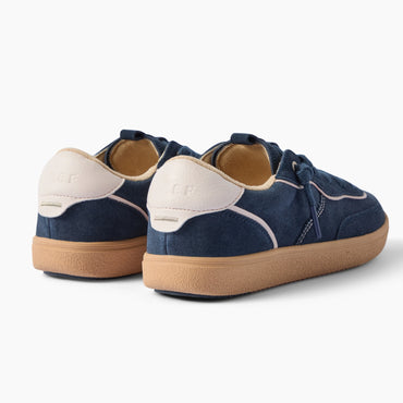Kickback navy sneakers, pair shown with the front shoe facing right and the heel of the other shoe visible