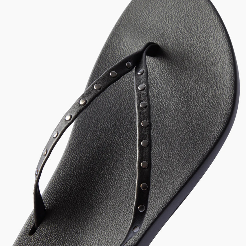 Top view of black Cushion Slim Studs sandal for women with studded straps and comfort cushioning for beachwear.