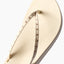 Close-up of the top strap and footbed of the Cushion Slim Studs sandal facing left, featuring comfort and durability.