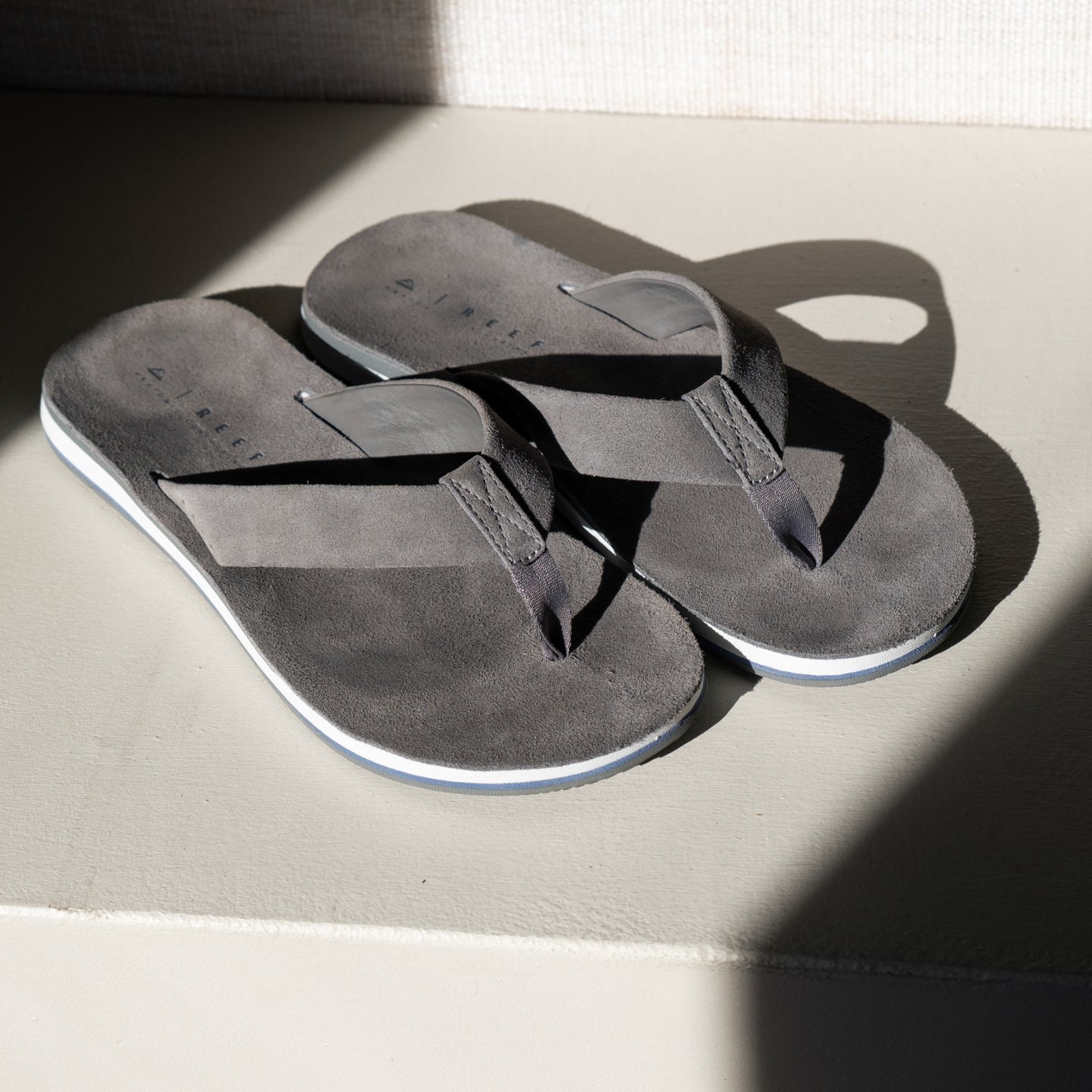 Ojai Classic men's grey flip flops facing upward showing top straps and soft-rebound cushioned footbed for comfort.