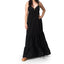 Woman wearing Yuni Maxi Dress with deep neckline and tie detail, paired with tan REEF sandals facing forward.