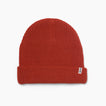 Alyx Beanie in chili red, front view showing knit texture and REEF tag, unisex comfort apparel for beach lifestyle.