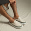 Rambler Kicker mule facing right in off-white with cushioned memory foam footbed and lightweight EVA outsole for all-day wear