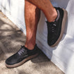 Verano men's black suede shoe facing right, showing side and top view with cushioned midsole and rugged outsole.