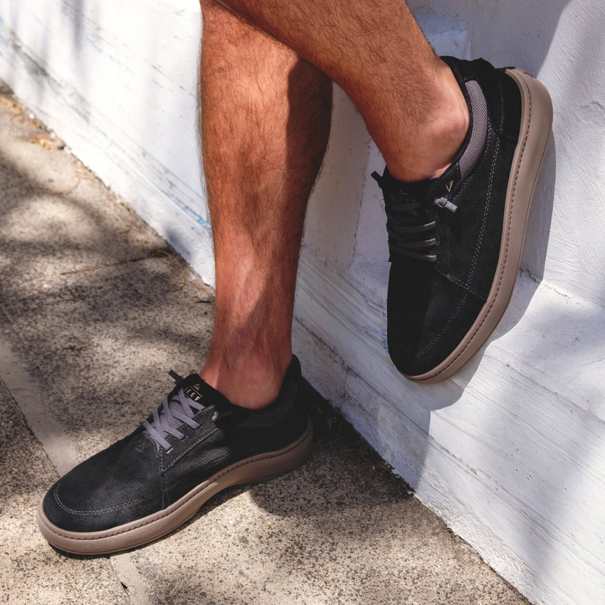 Verano men's black suede shoe facing right, showing side and top view with cushioned midsole and rugged outsole.