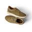 Pair of olive green Verano shoes shown from side and top view with suede upper, white sole, and laces for comfort and style