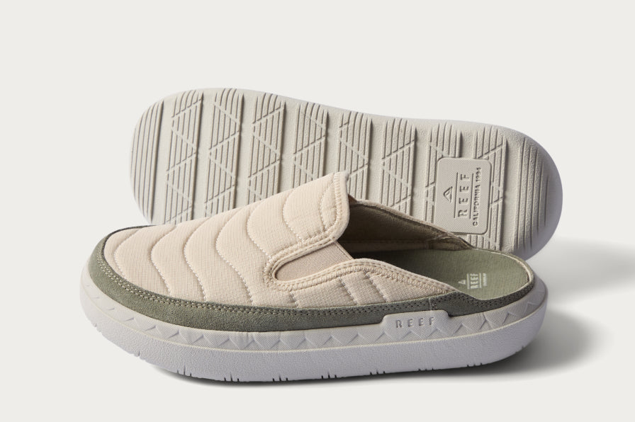 Pair of beige slip-on shoes showing quilted fabric upper and textured sole with REEF branding, angled left and top down view.
