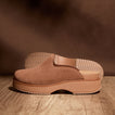 Vista Skye clog in brown suede facing left, showing side profile with platform sole and textured outsole, comfort design.