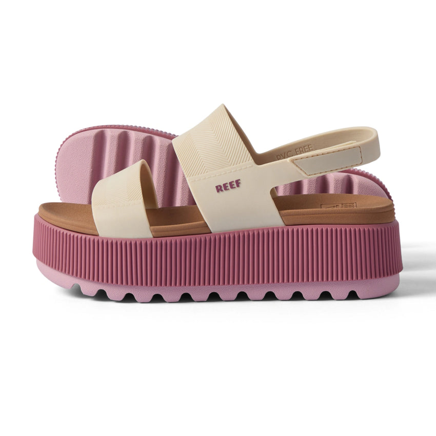 Side view of Water Vista Higher platform sandal with adjustable strap, pink sole, and cream upper for water friendly comfort