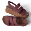 Top view and right side view of maroon platform sandals with textured straps and cushioned sole facing right