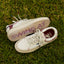 Palm X G-Papi cream sneakers facing opposite directions on grass with cushioned comfort