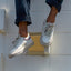 Palm X G-Papi white sneakers, one facing left and one facing forward, with cushioned soles
