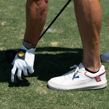 Palm X G-Papi white golf sneaker facing left in side view on grass with cushioned comfort support