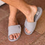 Phantom Slab men's grey slides facing forward, showing top and side, featuring soft cushioning and arch support.