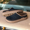 Rambler Mule black suede mule facing left with plush terry lining and cushioned sole