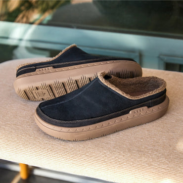 Rambler Mule black suede mule facing left with plush terry lining and cushioned sole