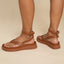 Vista Luxe Sierra women's brown sandals facing left and right, showing side and back straps with cushioned sole close-up.