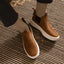 Evo brown men's slip-on shoes facing forward with soft-rebound cushioning and anatomical arch support on a woven rug.