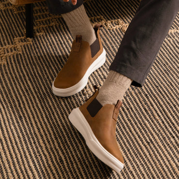 Evo men's brown slip-on shoes facing right, showing side and top with cushioned sole and arch support design.