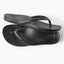 Vista Vay-Cay black flip flops for women, top view showing toe post and cushioned footbed, surf-inspired comfort design.