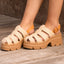 Vista Luxe Lucie sandals facing left, close-up of woven platform straps and chunky cushioned sole for comfort.
