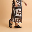 Woman wearing black Cushion Vista Hi sandals facing left in a close-up side view highlighting comfort and arch support.