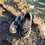 Shorebreak TRV men's black sneaker facing forward and sole up, surf-inspired with anatomical arch support and cushioning.
